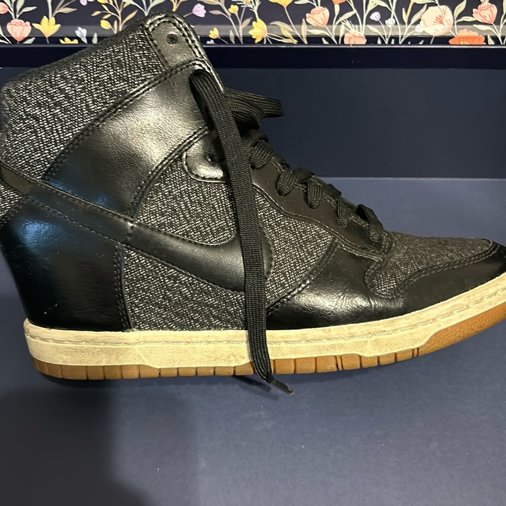 Black heeled Nike shoes